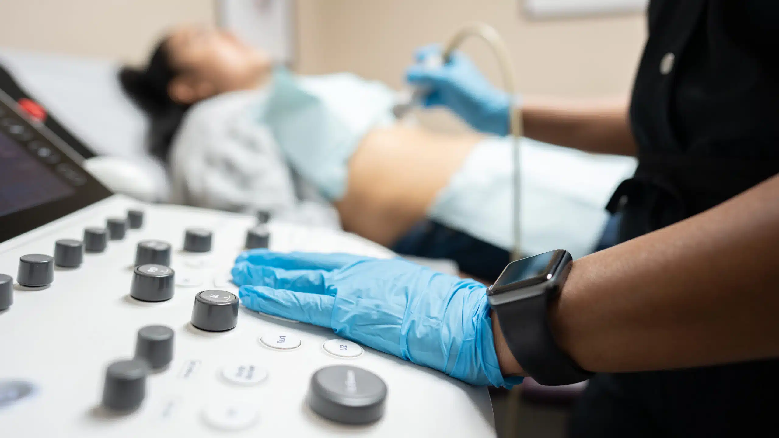 ultrasound imaging concepts close up on sonogram machine and patient getting a sonogram