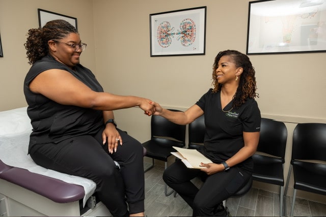 makeba with a patient during an appointment