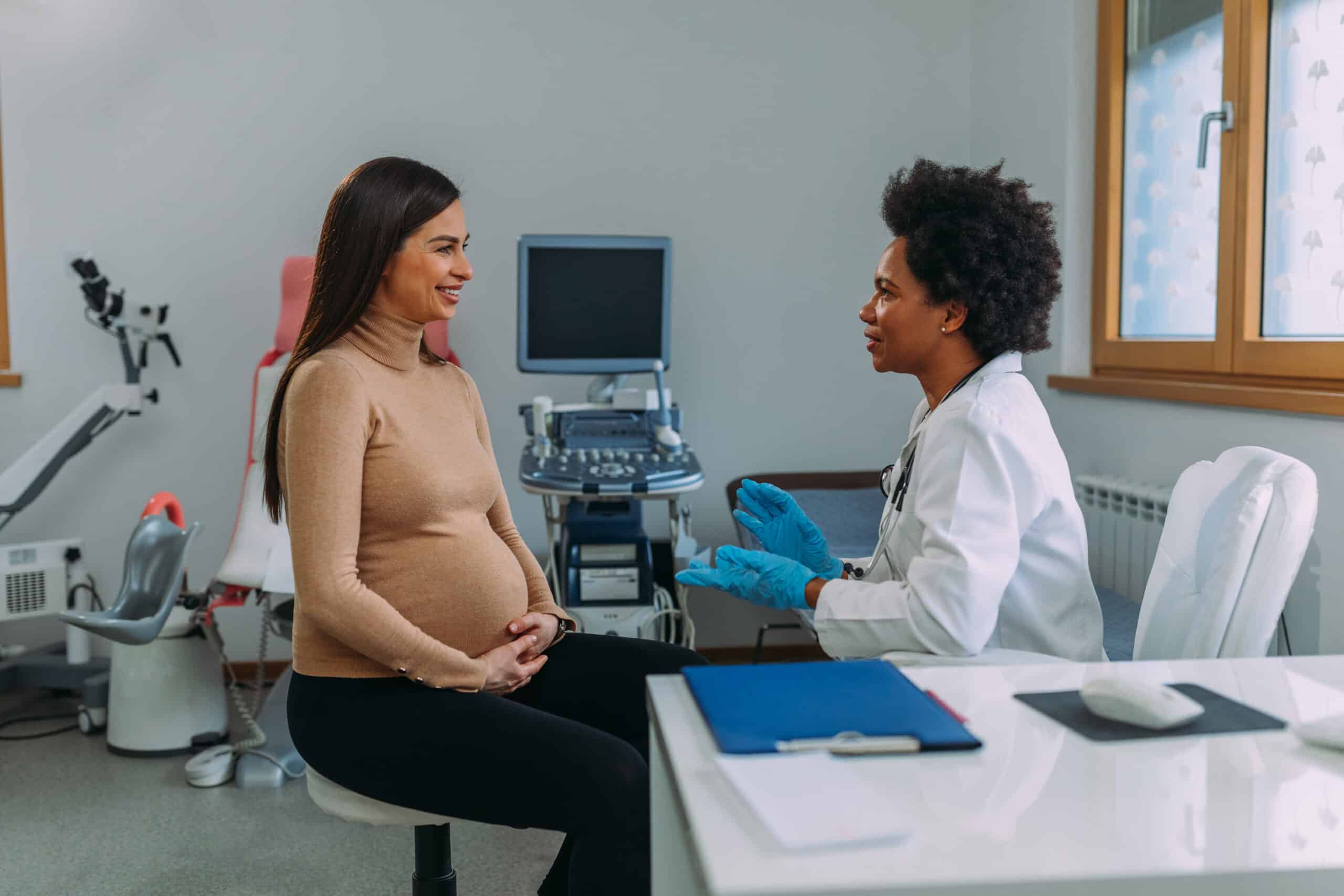 A pregnant woman during a routine check up with her doctor at hospital