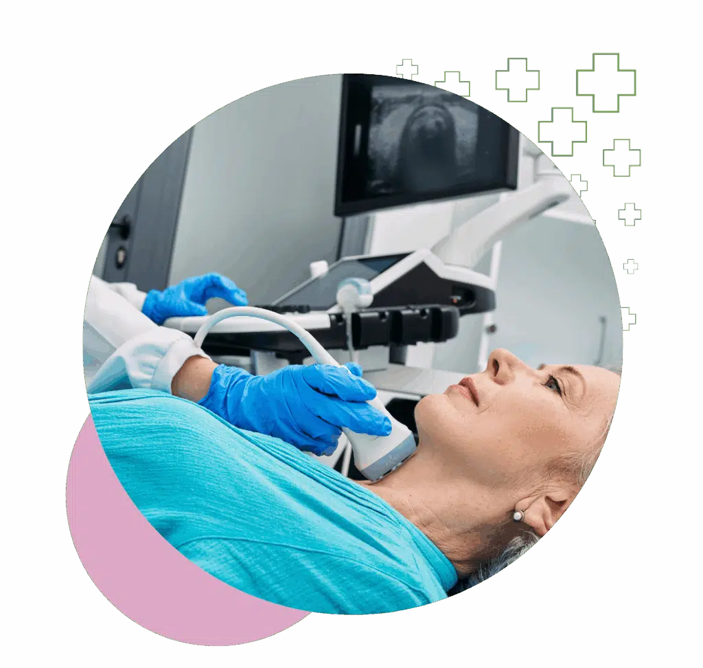 A woman receiving a thyroid ultrasound as a technician operates the transducer on her neck in a medical clinic.