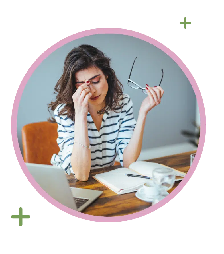 Woman feeling fatigue, a symptom often addressed during Blood Cancer Awareness Month screenings.